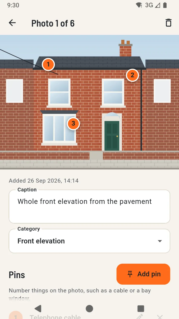 Photo of a terraced house front with three numbered pins